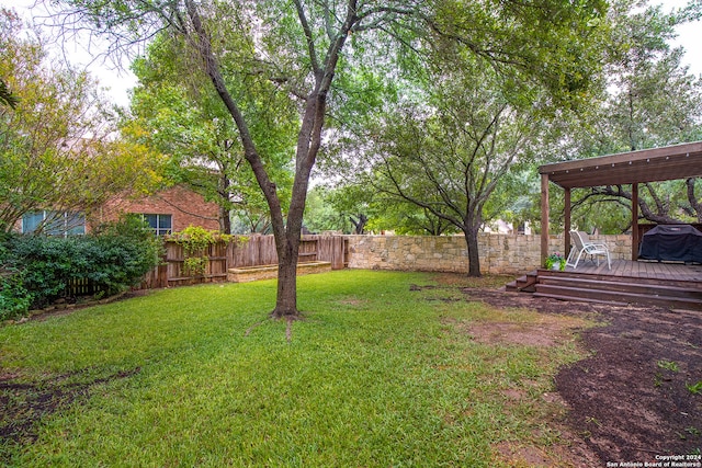 view of yard with a deck