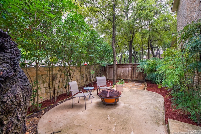 view of patio / terrace with an outdoor fire pit