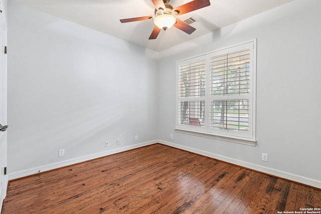 empty room with ceiling fan and wood-type flooring