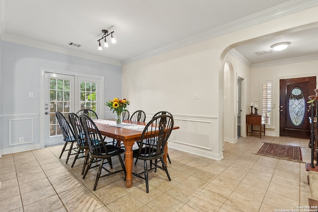 dining area featuring ornamental molding