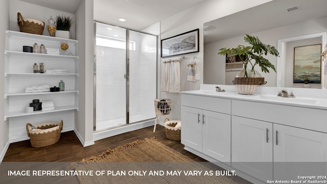 bathroom featuring a shower with door, vanity, and hardwood / wood-style flooring