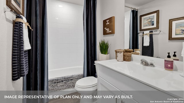 full bathroom featuring vanity, shower / bath combo with shower curtain, and toilet