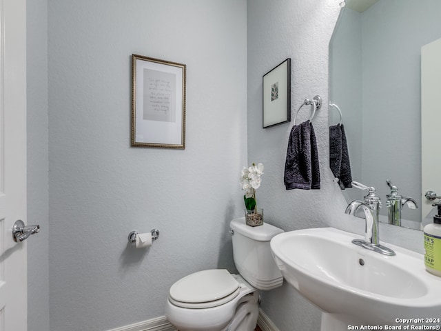 bathroom with sink and toilet