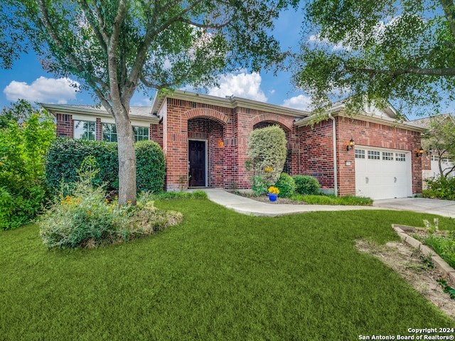 single story home with a front lawn and a garage