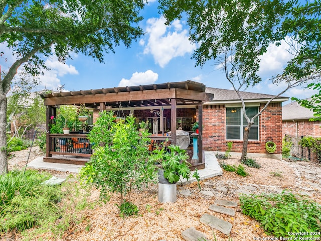 back of property featuring a pergola and a patio area