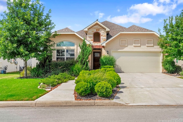 front of property with a garage and a front yard