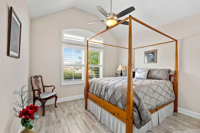 bedroom with lofted ceiling, light hardwood / wood-style floors, and ceiling fan