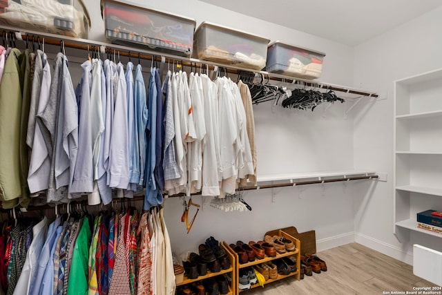 spacious closet featuring light hardwood / wood-style floors