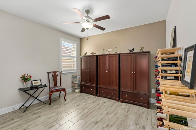 sitting room with ceiling fan and light hardwood / wood-style floors