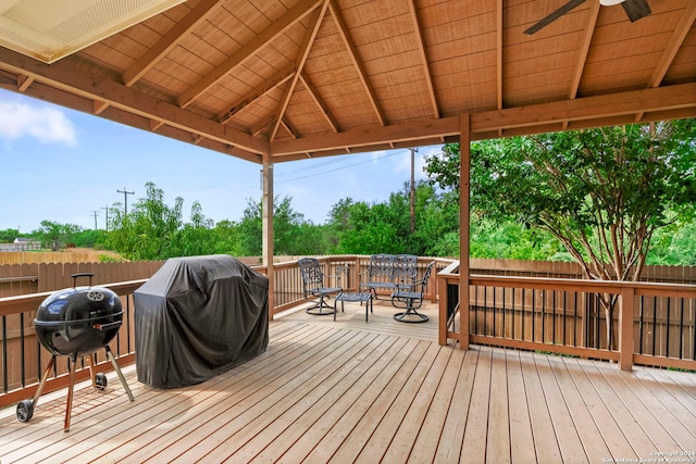 wooden deck with area for grilling and a gazebo