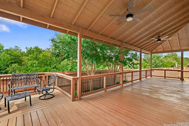 wooden deck featuring ceiling fan