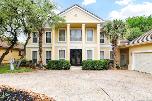 greek revival house with a garage