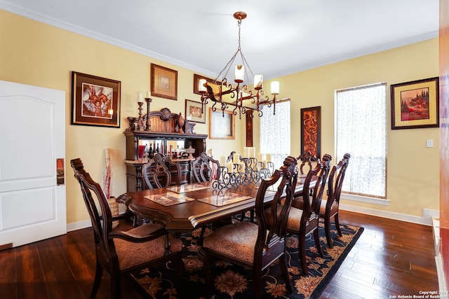 dining room featuring ornamental molding, dark hardwood / wood-style floors, a chandelier, and a wealth of natural light