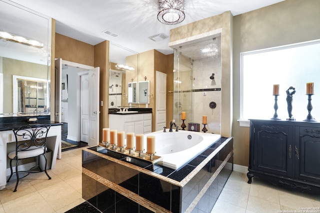 bathroom featuring vanity, plus walk in shower, and tile patterned floors