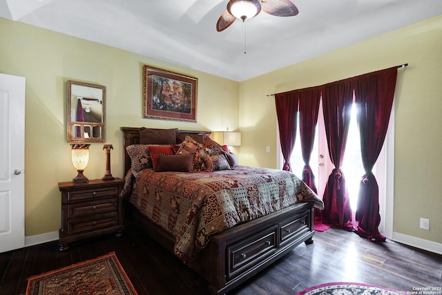 bedroom featuring ceiling fan and dark hardwood / wood-style floors