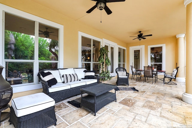 view of patio / terrace with ceiling fan and an outdoor living space