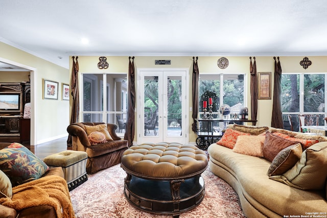 living room with french doors, hardwood / wood-style flooring, and crown molding