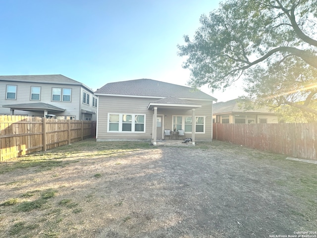 rear view of property featuring a patio