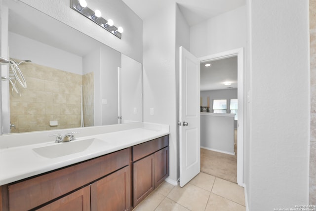 bathroom with vanity, tile patterned floors, and tiled shower