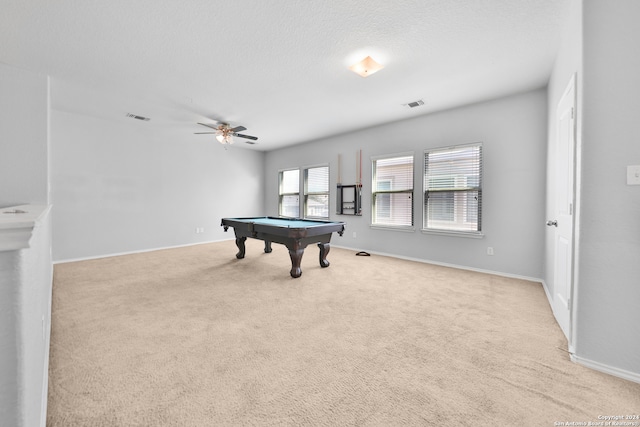 rec room with ceiling fan, light carpet, a textured ceiling, and pool table