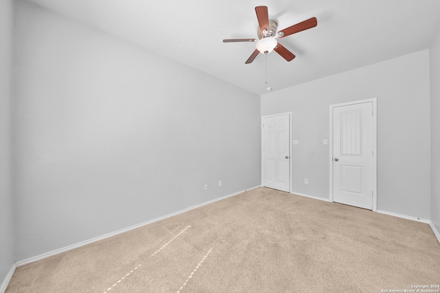 unfurnished room with carpet flooring and ceiling fan