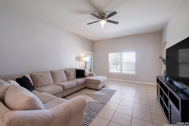 tiled living room with ceiling fan