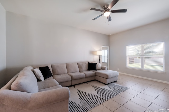 tiled living room with ceiling fan