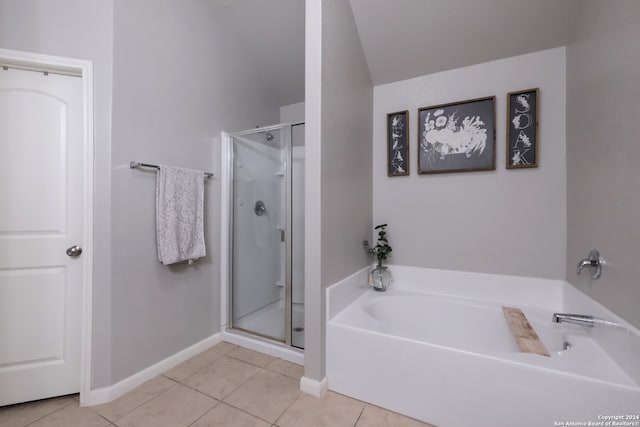 bathroom with shower with separate bathtub and tile patterned flooring