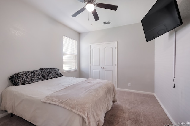 bedroom featuring a closet, carpet, and ceiling fan