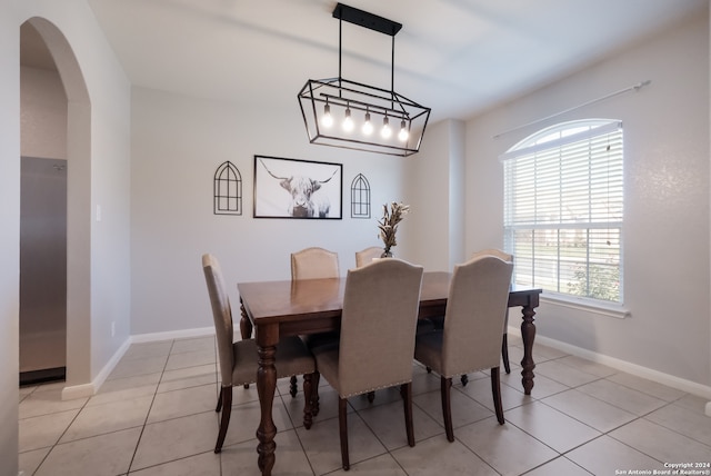 dining area with light tile patterned floors