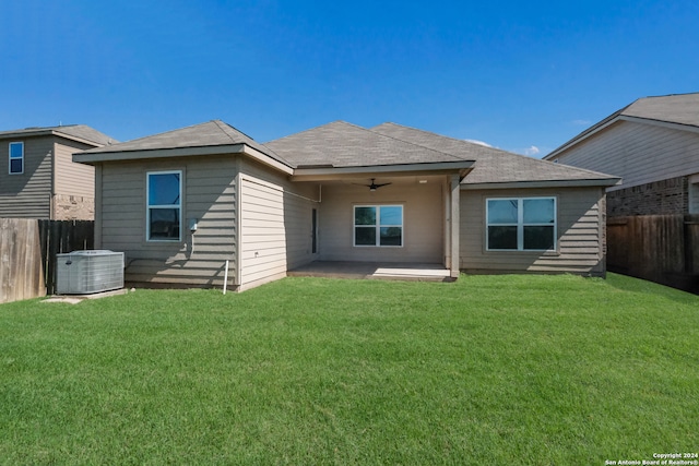 back of property featuring a lawn, ceiling fan, a patio area, and central air condition unit