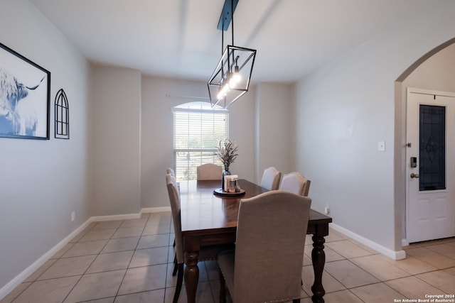 dining space featuring light tile patterned flooring