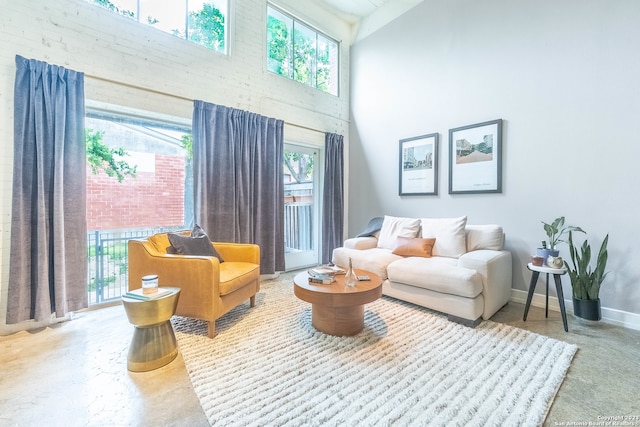 living room featuring a towering ceiling