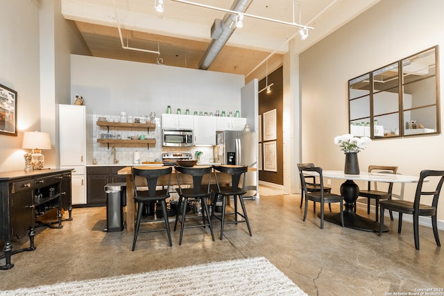 dining room featuring a high ceiling