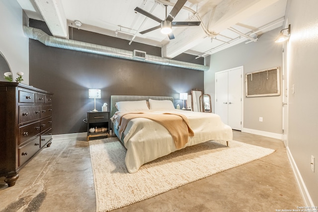 bedroom with beamed ceiling and ceiling fan