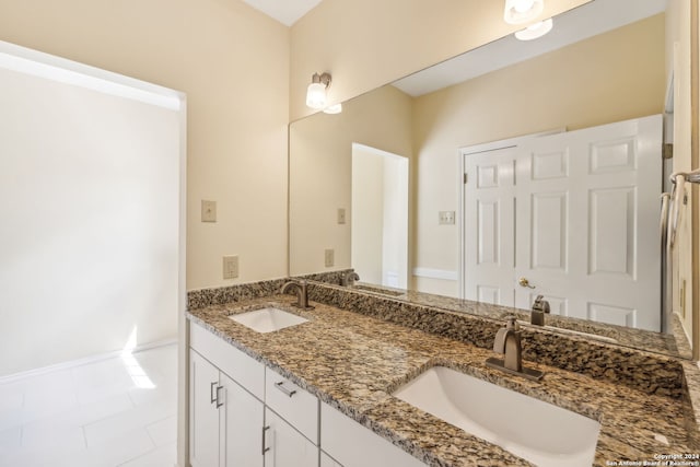 bathroom with tile patterned floors and vanity