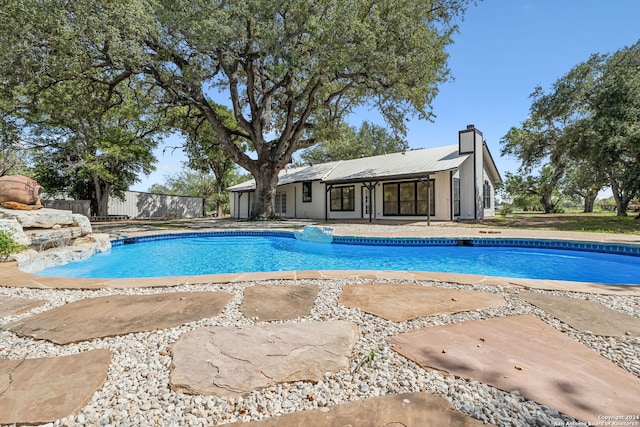 view of swimming pool with a patio