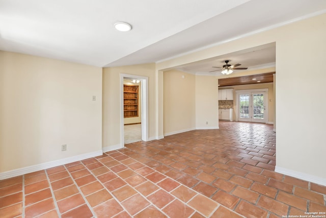 unfurnished room with ceiling fan, crown molding, french doors, and tile patterned floors