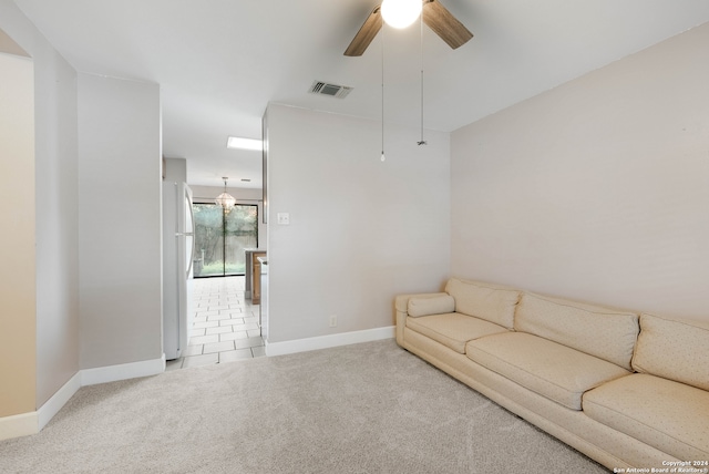 living room with ceiling fan and carpet floors