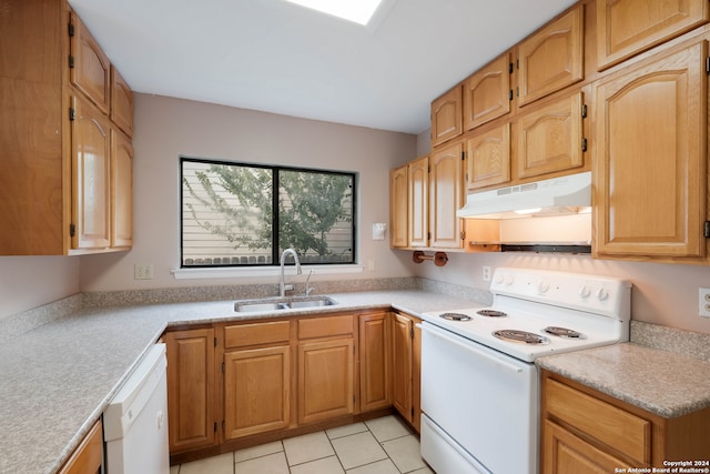 kitchen with white appliances, light tile patterned flooring, and sink