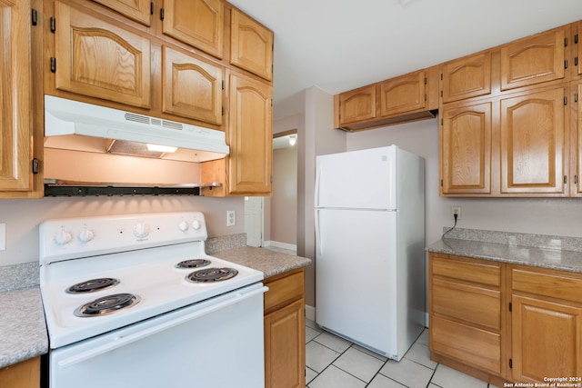 kitchen featuring white appliances and light tile patterned floors