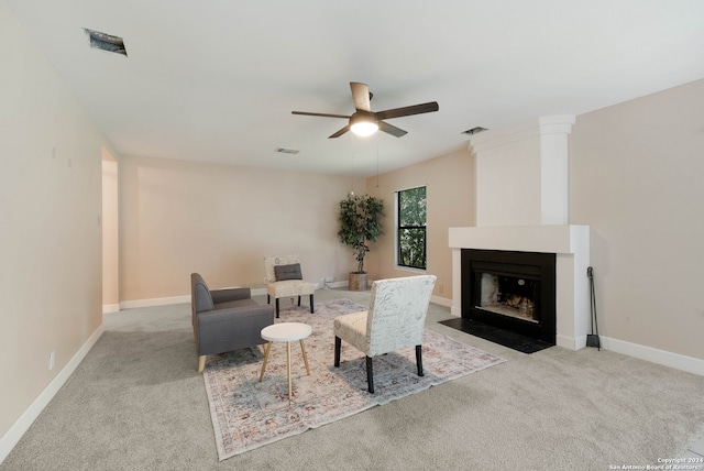 living room featuring ceiling fan and light colored carpet