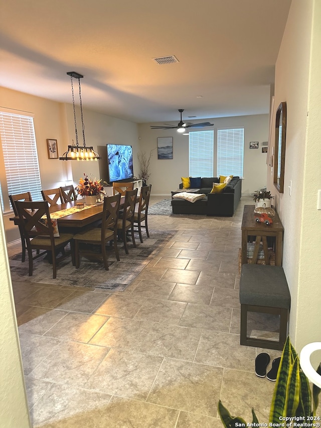 dining space featuring ceiling fan