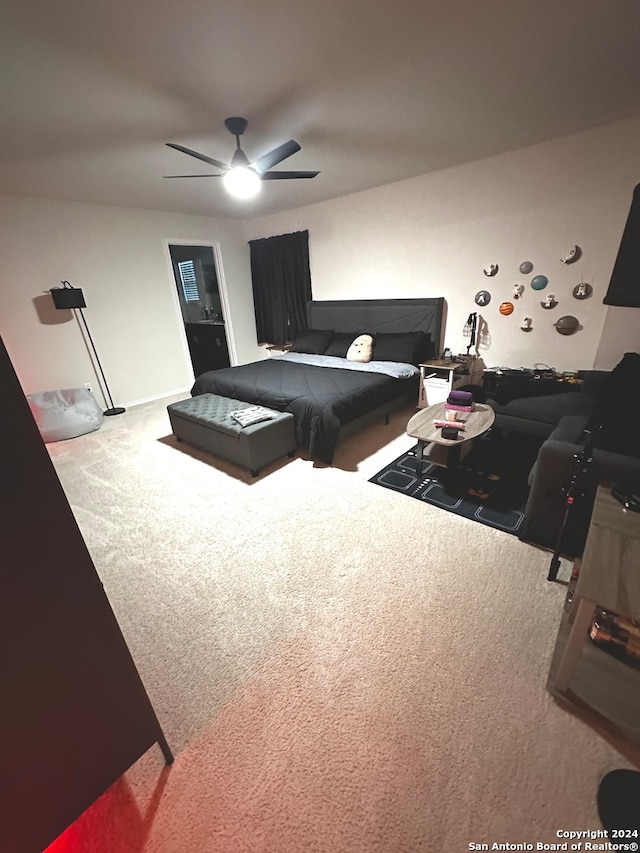 carpeted bedroom with ceiling fan