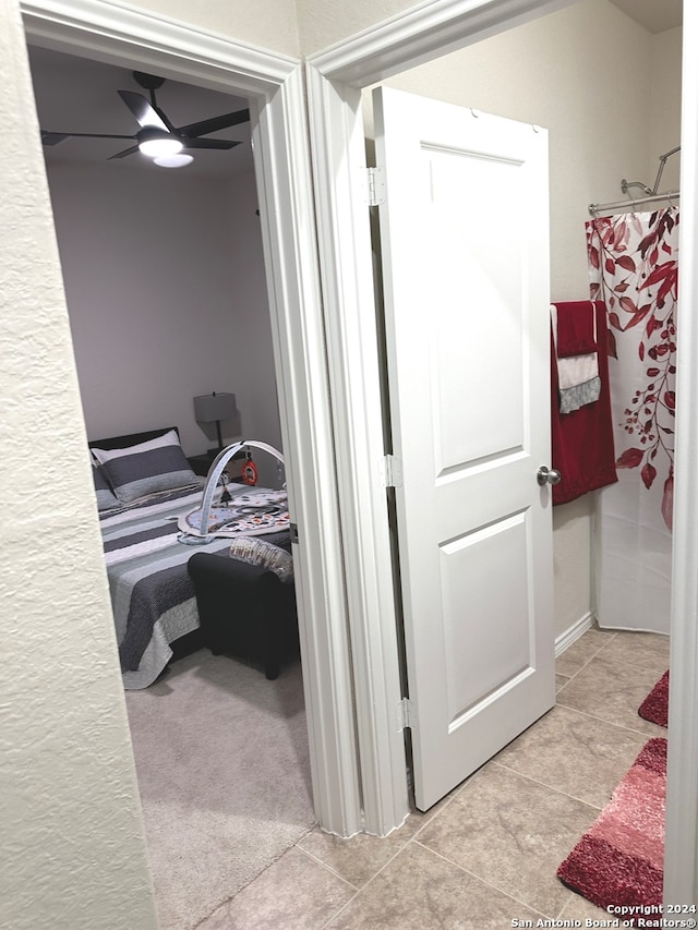 bedroom featuring ceiling fan and light tile patterned floors