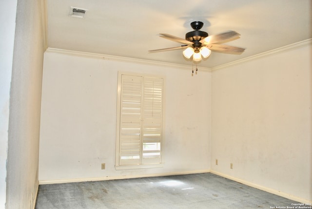 spare room featuring carpet floors, ceiling fan, and crown molding