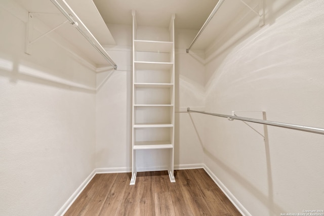 spacious closet featuring hardwood / wood-style floors