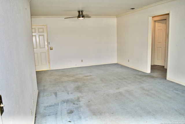 unfurnished room with crown molding, ceiling fan, and light carpet