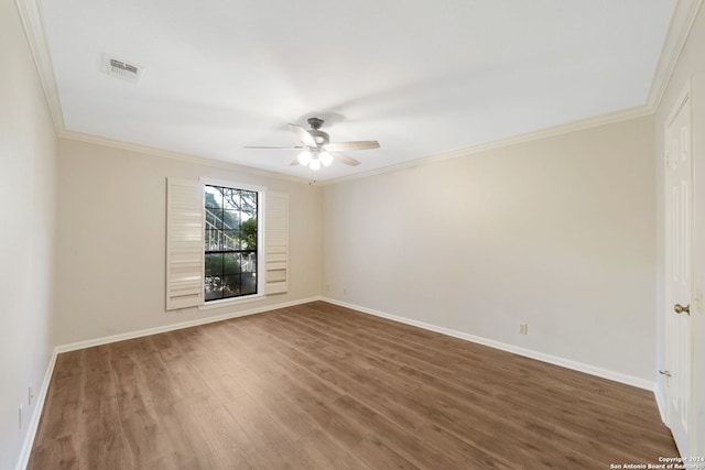 empty room featuring hardwood / wood-style flooring, ceiling fan, and crown molding