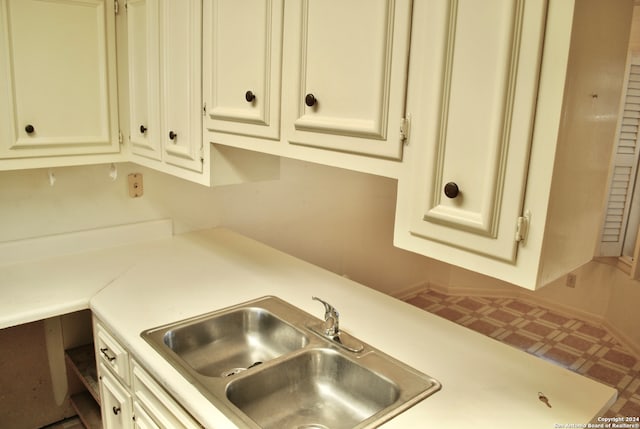 kitchen featuring sink and cream cabinets